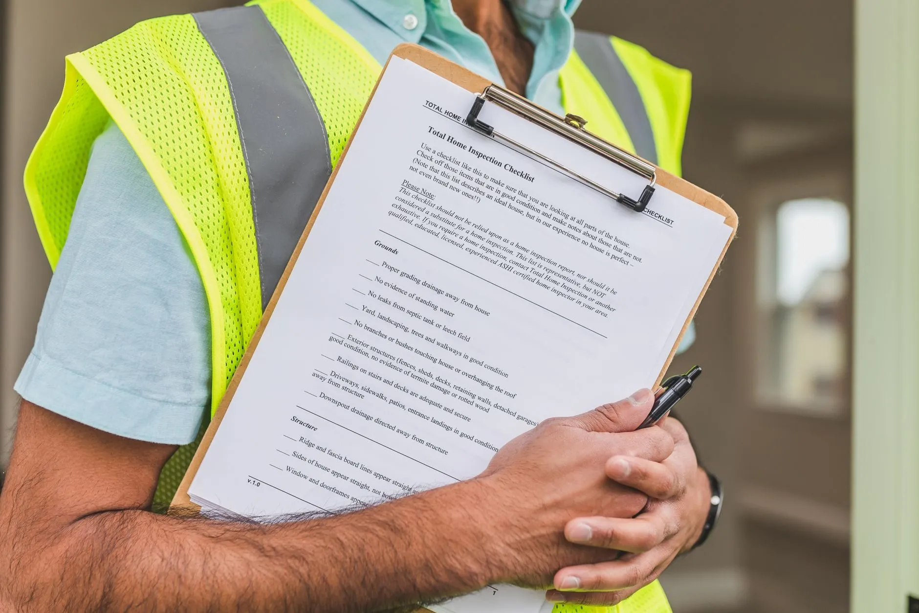 A technician holding a clipboard with an inspection checklist